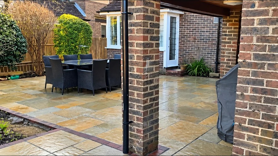 Finished stone patio beside a British home